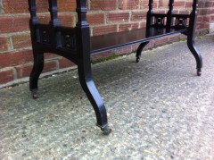 An ebonised oblong sidetable with subtle carved details - Thumbnail 7