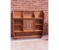 An oak hanging bookcase with open shelves placed around a central door - Thumbnail 2