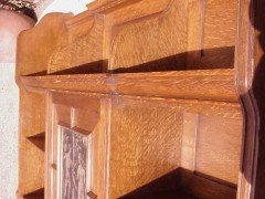 An oak hanging bookcase with open shelves placed around a central door - Thumbnail 3