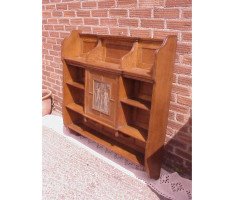 An oak hanging bookcase with open shelves placed around a central door - Thumbnail 4