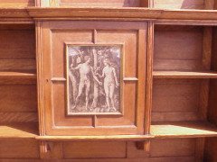 An oak hanging bookcase with open shelves placed around a central door - Thumbnail 6