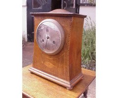 Liberty and Co. An Arts and Crafts oak mantle clock in the style of C F A Voysey - Thumbnail 2