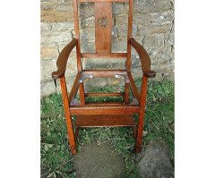 An Arts and Crafts Cotswold School armchair with lower shelf and pierced floral detail - Thumbnail 2