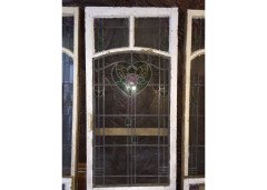 A set of stained glass doors and windows, riddled with intricate floral detailing. - Thumbnail 2