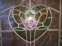 A set of stained glass doors and windows, riddled with intricate floral detailing. - Thumbnail 3