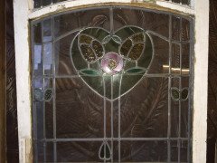 A set of stained glass doors and windows, riddled with intricate floral detailing. - Thumbnail 4