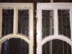 A set of stained glass doors and windows, riddled with intricate floral detailing. - Thumbnail 6