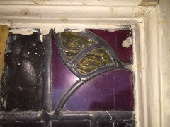 A set of stained glass doors and windows, riddled with intricate floral detailing. - Thumbnail 7